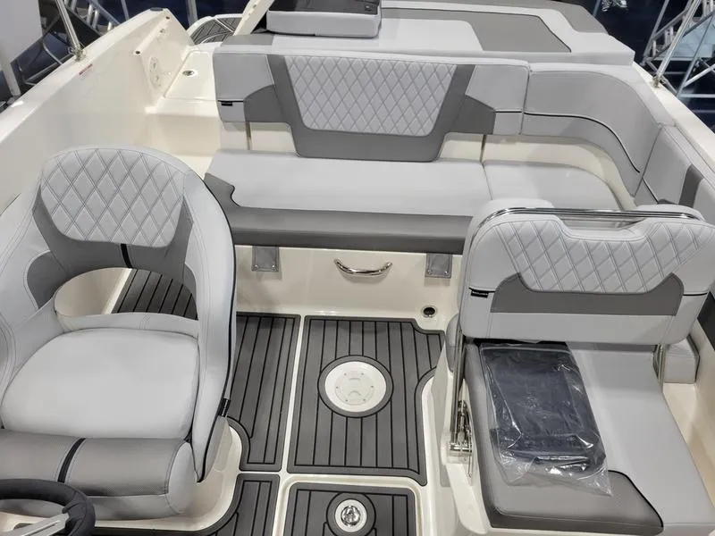 Slide: The Image of 2025 Bayliner VR5 OB boat interior with gray seating and modern design. - 10