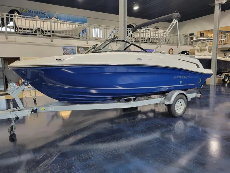 Slide: The Image of 2025 Bayliner VR5 OB boat on trailer in showroom. - 2