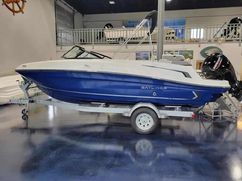 Slide: The Image of 2025 Bayliner VR5 OB boat on trailer in showroom. - 4