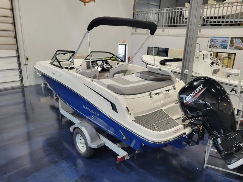 Slide: The Image of 2025 Bayliner VR5 OB boat with Mercury outboard engine in showroom. - 5