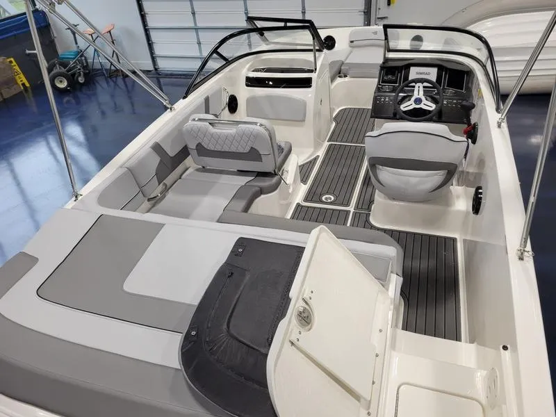 Slide: The Image of 2025 Bayliner VR5 OB boat interior with modern seating and sleek design. - 6