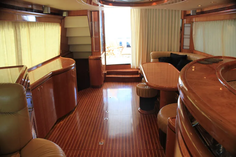 Slide: The Image of Luxurious 2004 Horizon P70 yacht interior with elegant wood finishes and plush seating. - 13