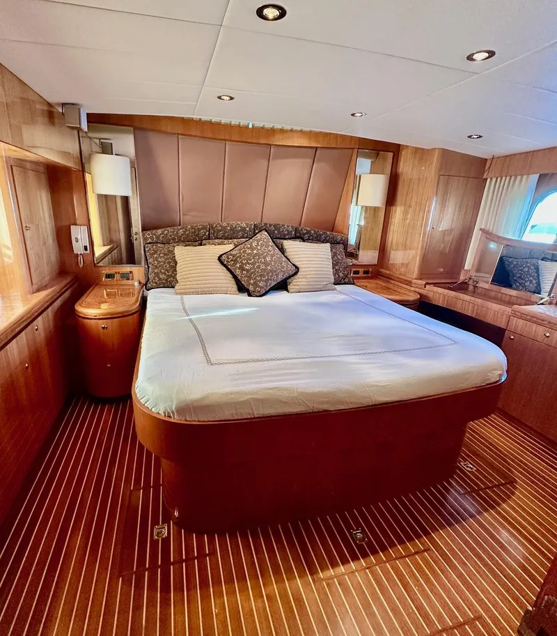 Slide: The Image of Luxurious cabin interior of 2004 Horizon P70 yacht with elegant wood finish. - 16
