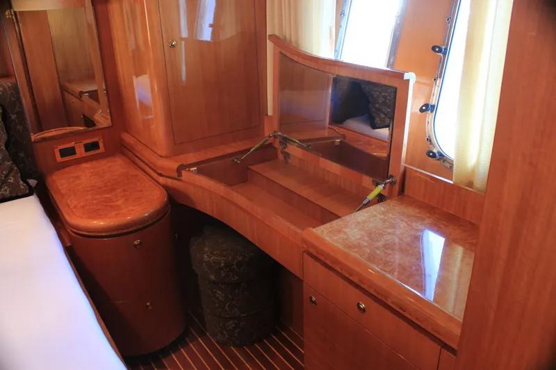Slide: The Image of Luxurious wooden interior of 2004 Horizon P70 yacht cabin with vanity and storage. - 18