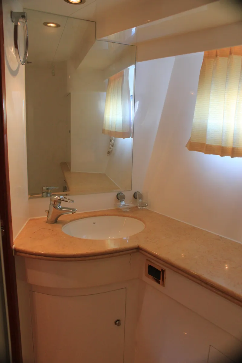 Slide: The Image of Luxurious bathroom in 2004 Horizon P70 yacht with elegant sink and mirror. - 21