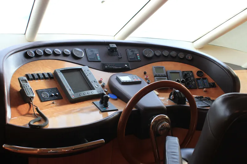 Slide: The Image of Cockpit of a 2004 Horizon P70 yacht with navigation instruments and steering wheel. - 23