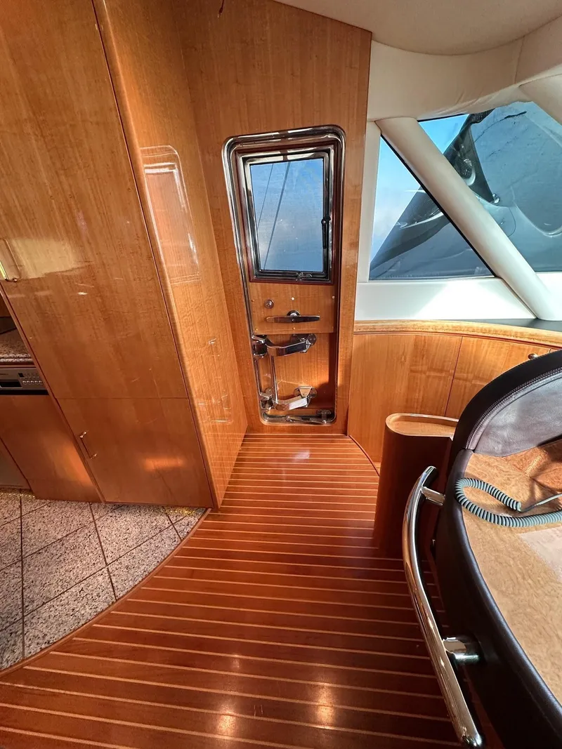 Slide: The Image of Luxurious 2004 Horizon P70 yacht interior with polished wood flooring and modern design. - 25