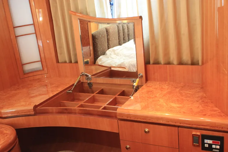Slide: The Image of Luxurious wooden vanity with mirror and storage compartments on Horizon P70 yacht, 2004 model. - 33
