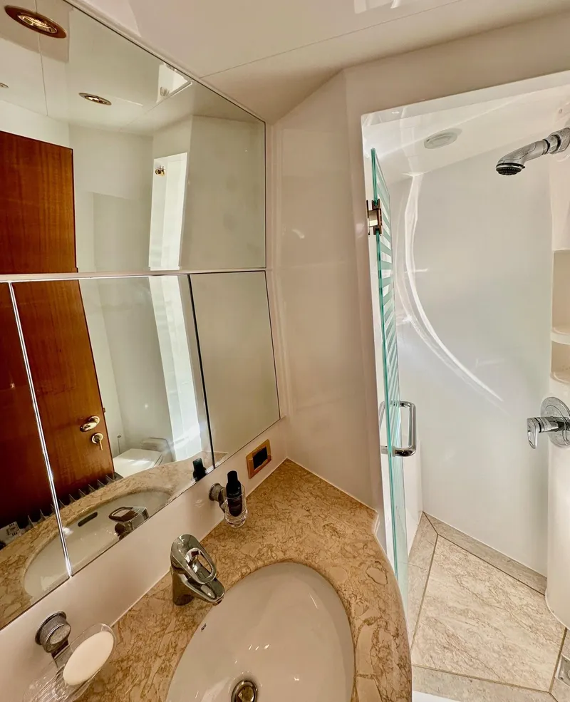 Slide: The Image of Luxurious bathroom in 2004 Horizon P70 yacht with modern fixtures and mirrored cabinets. - 40