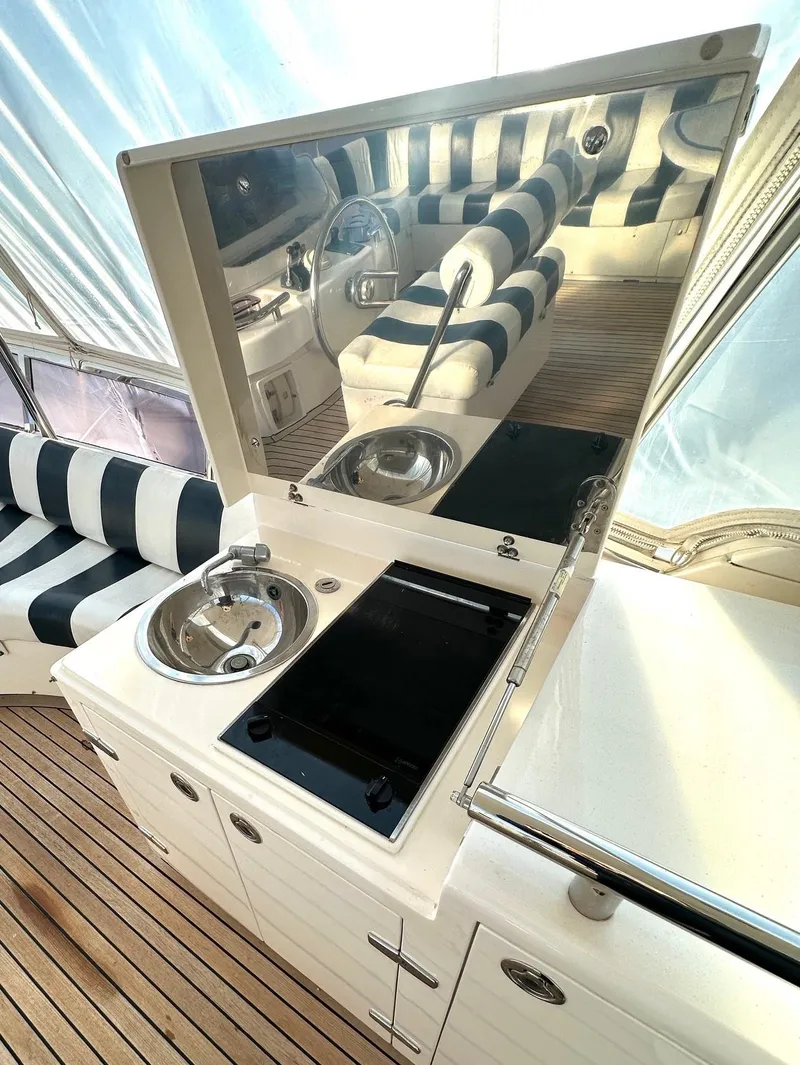Slide: The Image of Luxurious Horizon P70 yacht interior with kitchenette and striped seating, 2004 model. - 43