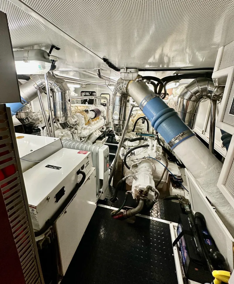 Slide: The Image of Engine room of 2004 Horizon P70 yacht with complex machinery and piping systems. - 47