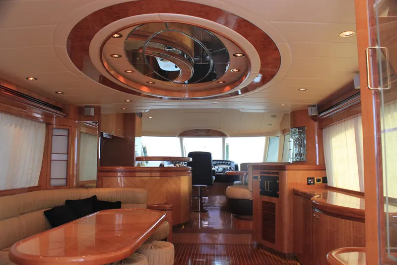 Slide: The Image of Luxurious interior of 2004 Horizon P70 yacht with elegant wood finishes and modern design. - 7