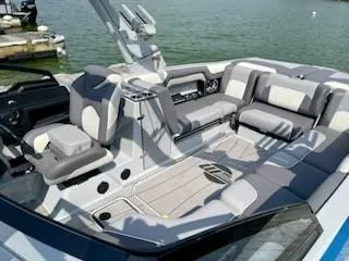 Slide: The Image of 2021 Malibu Wakesetter 25 LSV interior with luxurious seating and modern design. - 7