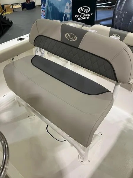Slide: The Image of 2025 Key West 203 FS boat seat with gray upholstery and KW logo. - 9