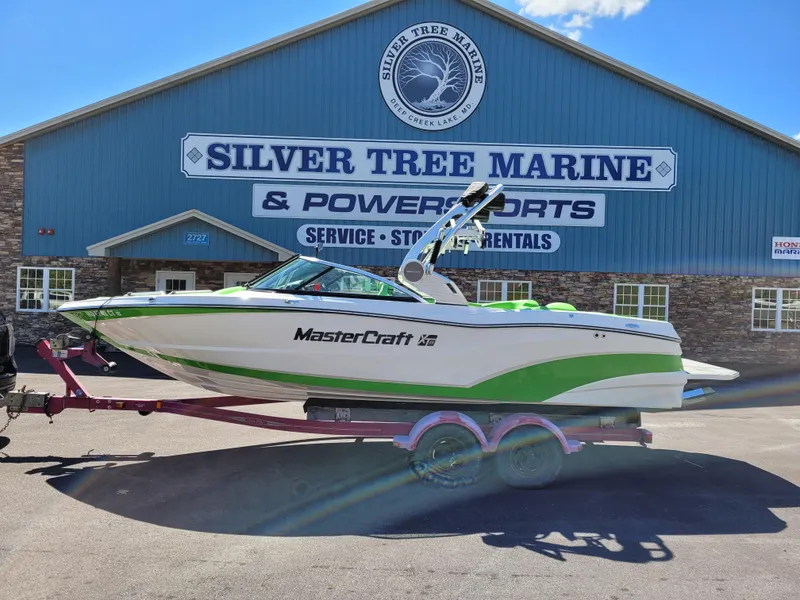 The Image of 2019 MasterCraft XT23 boat on trailer at Silver Tree Marine dealership. - 0