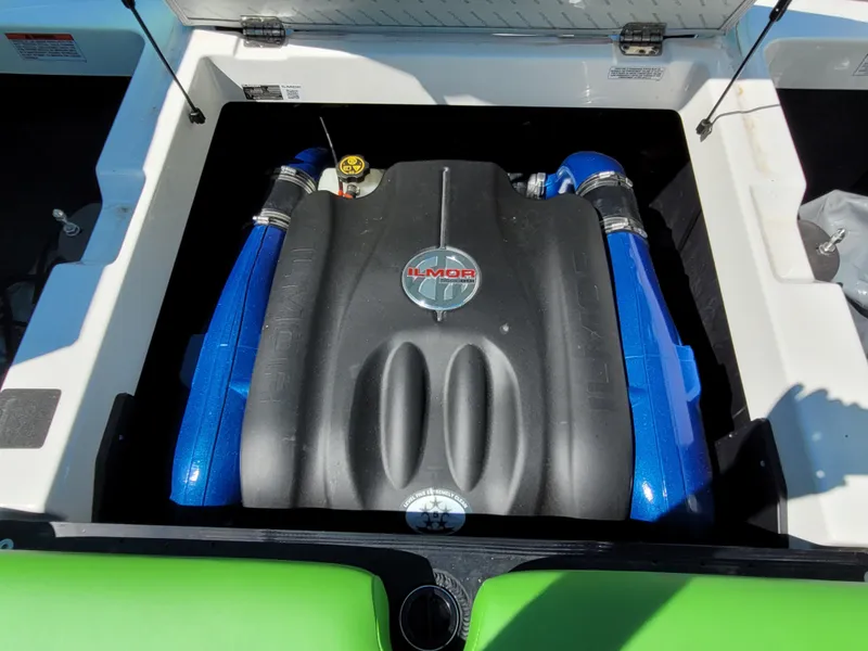 Slide: The Image of 2019 MasterCraft XT23 engine compartment with Ilmor engine, featuring blue accents. - 13