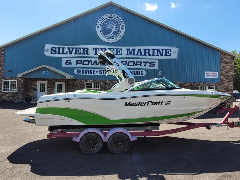 Slide: The Image of 2019 MasterCraft XT23 boat on trailer at Silver Tree Marine dealership. - 5