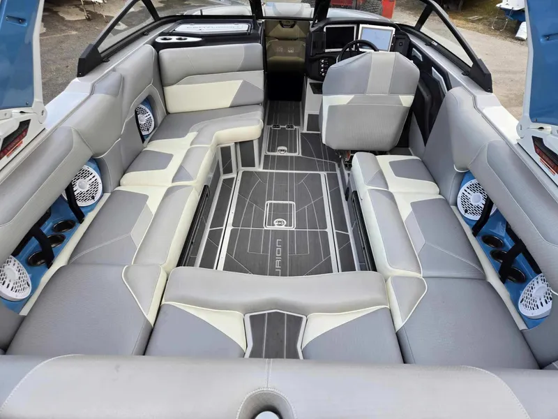 Slide: The Image of 2023 Centurion Ri230 boat interior with spacious seating and modern design. - 4