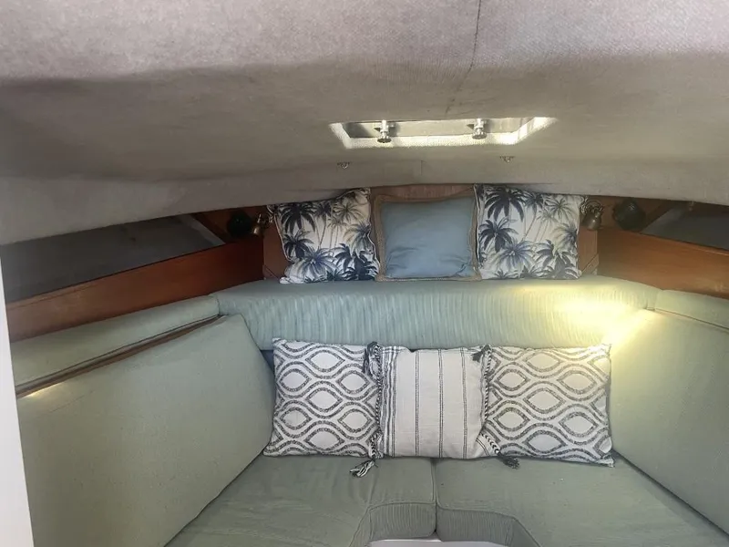 Slide: The Image of Cozy cabin interior of 1987 Rampage 31 Express with decorative pillows. - 17