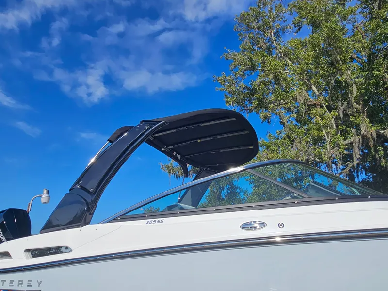 Slide: The Image of 2025 Monterey 255SS boat against blue sky and trees. - 10