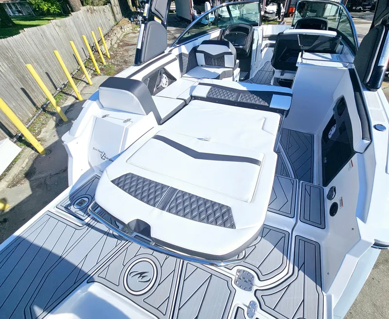 Slide: The Image of 2025 Monterey 255SS boat interior with sleek seating and modern design. - 13
