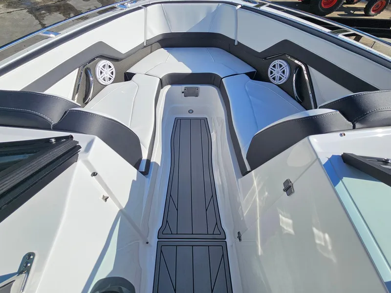 Slide: The Image of 2025 Monterey 255SS boat interior with sleek seating and modern design. - 24
