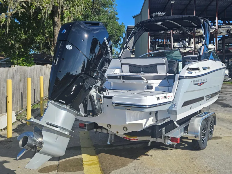 Slide: The Image of 2025 Monterey 255SS boat with powerful outboard motor, parked on a trailer. - 5