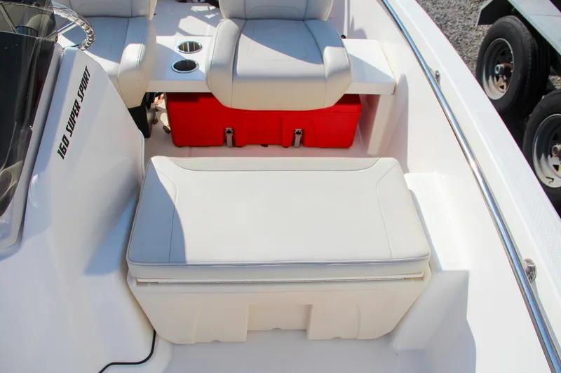 Slide: The Image of 2022 Boston Whaler 160 Super Sport interior seating with storage compartment. - 14