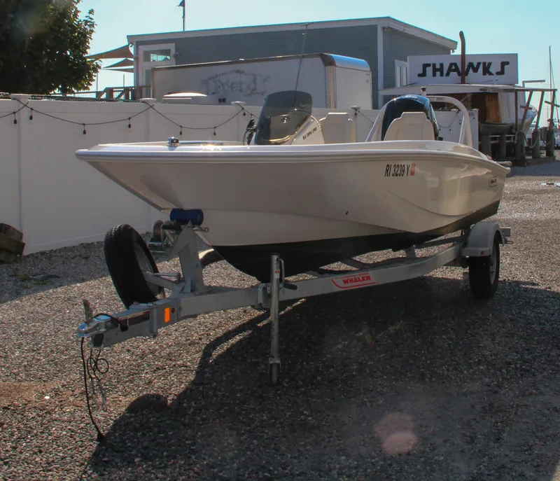 Slide: The Image of 2022 Boston Whaler 160 Super Sport boat on trailer in outdoor setting. - 4