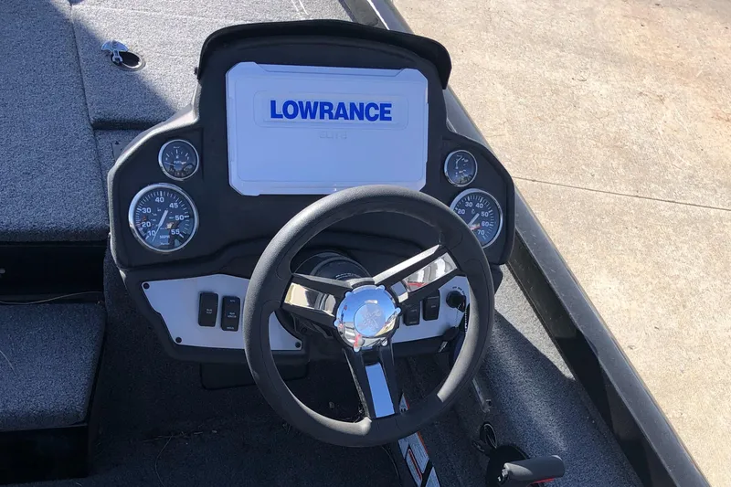 Slide: The Image of 2023 Ranger RT188P boat dashboard with Lowrance display and steering wheel. - 10