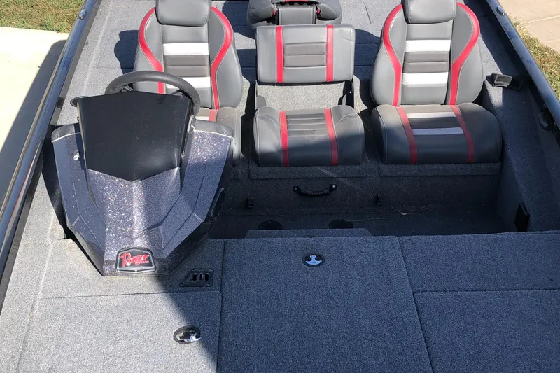 Slide: The Image of 2023 Ranger RT188P boat interior with gray and red seating. - 13