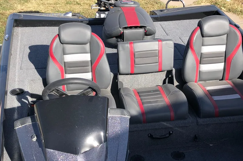 Slide: The Image of 2023 Ranger RT188P boat interior with gray and red seats. - 4
