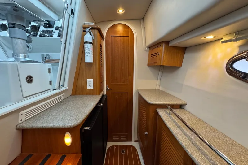 Slide: The Image of 2006 Glacier Bay 3470 Ocean Runner interior with wood cabinetry and modern amenities. - 15