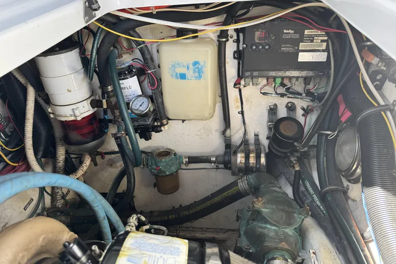 Slide: The Image of Engine compartment of a 2006 Glacier Bay 3470 Ocean Runner with various mechanical components. - 21