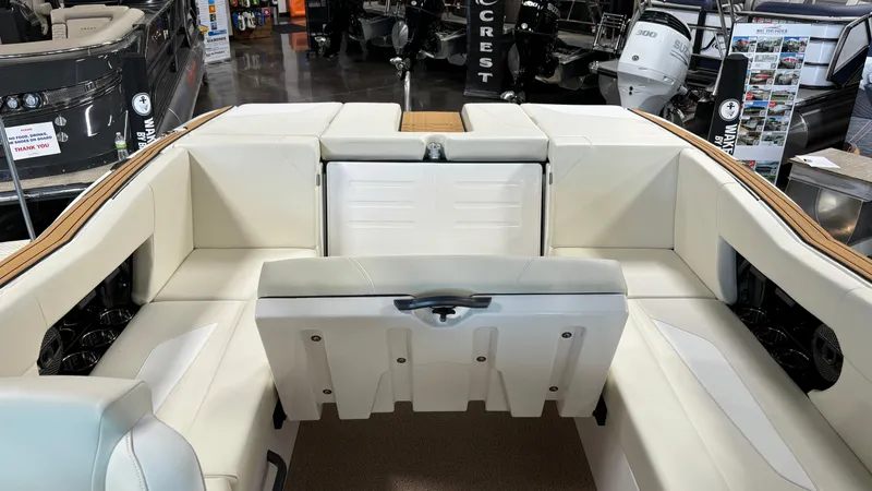 Slide: The Image of 2025 MasterCraft NXT23 boat interior with white seating and modern design. - 14