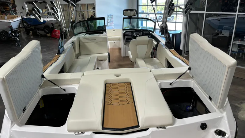 Slide: The Image of 2025 MasterCraft NXT23 boat interior with spacious seating and modern design. - 18