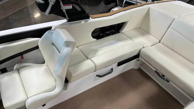 Slide: The Image of 2025 MasterCraft NXT23 interior with white leather seating and modern design. - 26