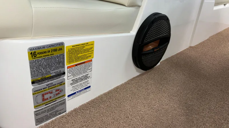 Slide: The Image of MasterCraft NXT23 2025 boat interior with capacity label and speaker detail. - 35