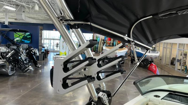 Slide: The Image of 2025 MasterCraft NXT23 boat with wakeboard rack in showroom. - 38