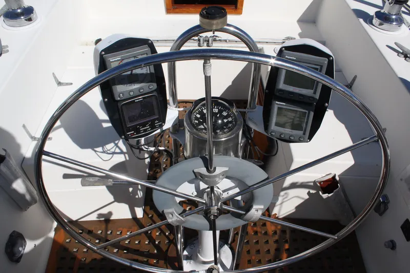 Slide: The Image of Steering wheel and navigation instruments on a 1976 C&C 38 sailboat. - 17