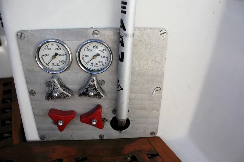 Slide: The Image of Control panel of a 1976 C&C 38 sailboat with gauges and levers. - 21