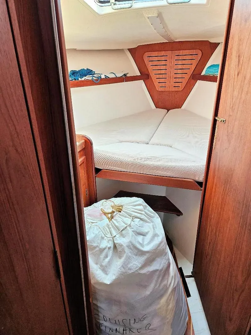 Slide: The Image of Interior of a 1976 C&C 38 sailboat with a cozy V-berth cabin. - 23