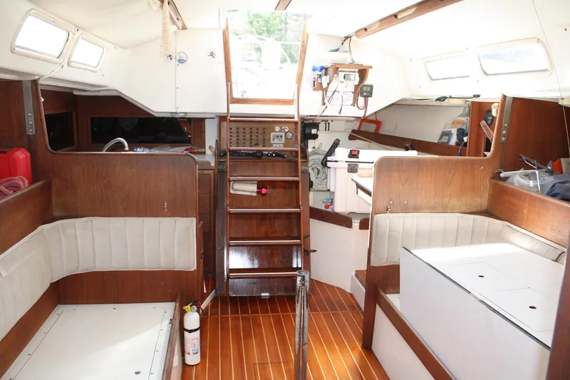 Slide: The Image of Interior of a 1976 C&C 38 sailboat with wooden finishes and seating. - 32
