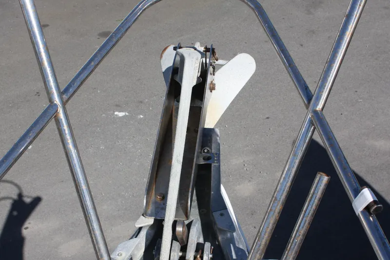 Slide: The Image of Bow of a 1976 C&C 38 sailboat with anchor and metal railings. - 9