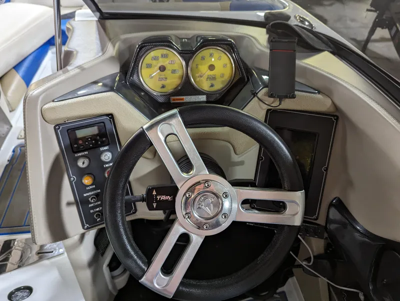 Slide: The Image of Dashboard of a 2014 Centurion Enzo SV233 boat with steering wheel and gauges. - 11