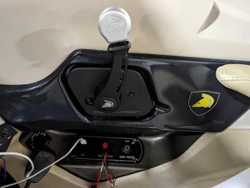 Slide: The Image of 2014 Centurion Enzo SV233 boat control panel with throttle and logo. - 13