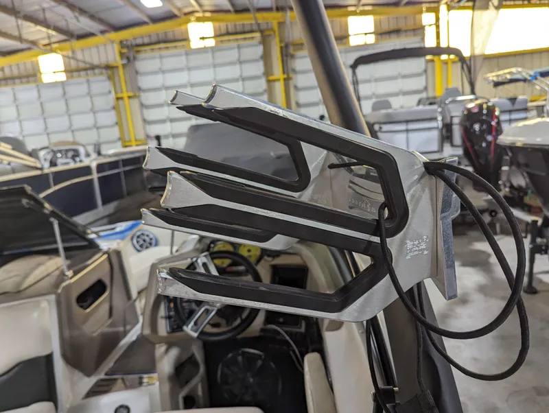 Slide: The Image of Wakeboard rack on 2014 Centurion Enzo SV233 boat in a storage facility. - 14