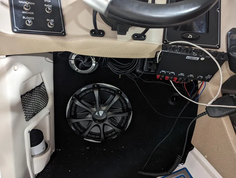 Slide: The Image of 2014 Centurion Enzo SV233 boat dashboard with speaker and control panel. - 15