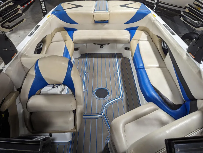 Slide: The Image of 2014 Centurion Enzo SV233 boat interior with beige and blue seating. - 17