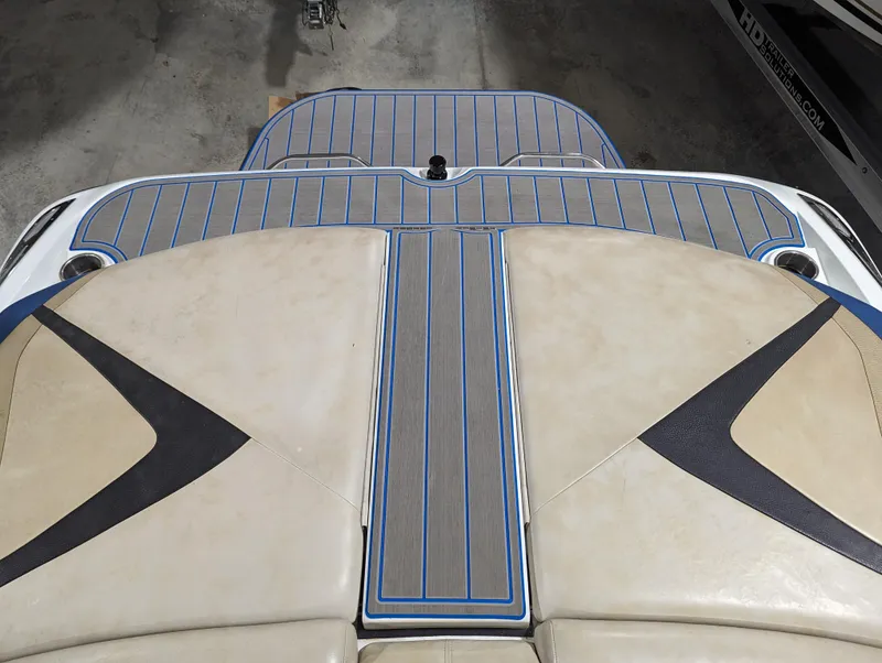 Slide: The Image of 2014 Centurion Enzo SV233 boat interior with beige and blue accents. - 19